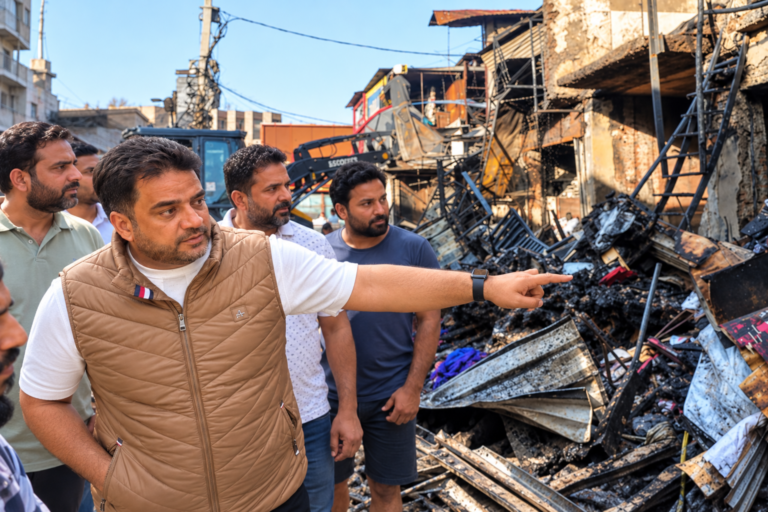 AIP Leader Visits Fire-Hit Shiv Market